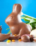 Chocolate rabbit with eggs and candy.