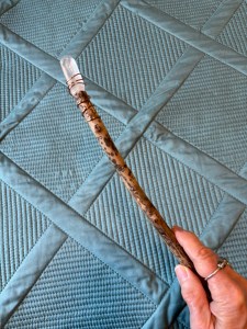 My wand, wood tipped with a clear quartz crystal.