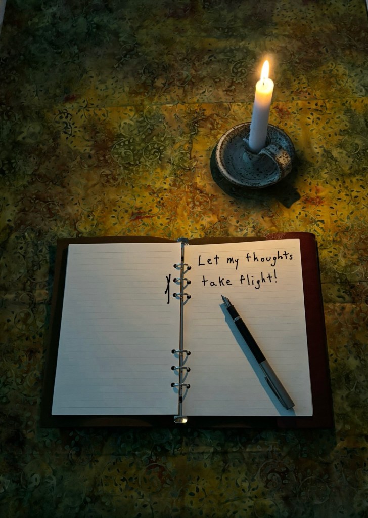Journal with these words written in it: “Let my thoughts take flight!” 